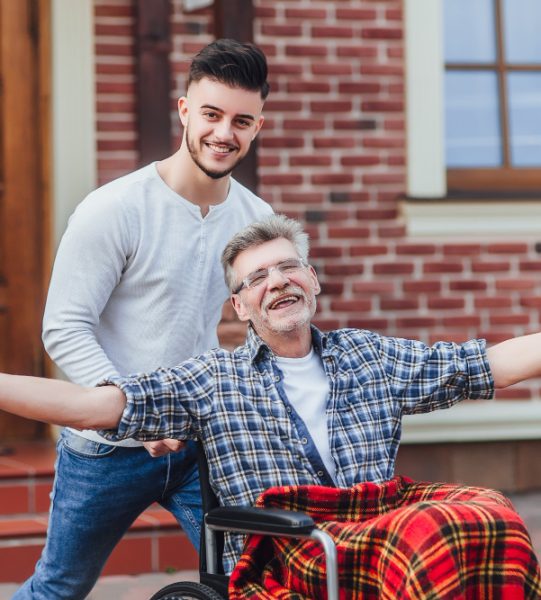 senior-father-wheelchair-young-son-walk