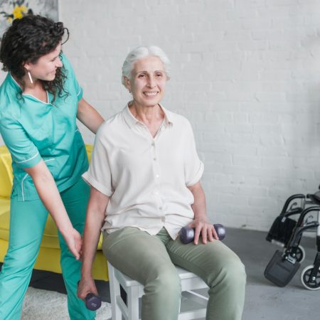 young-pretty-nurse-assisting-old-woman-his-therapy